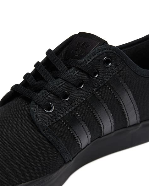 adidas full black sneakers.